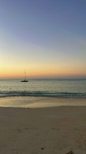 sunset beach sailboat 