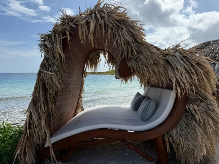 Heart-shaped thatched lounger on the beach at Sandals Royal Curaçao