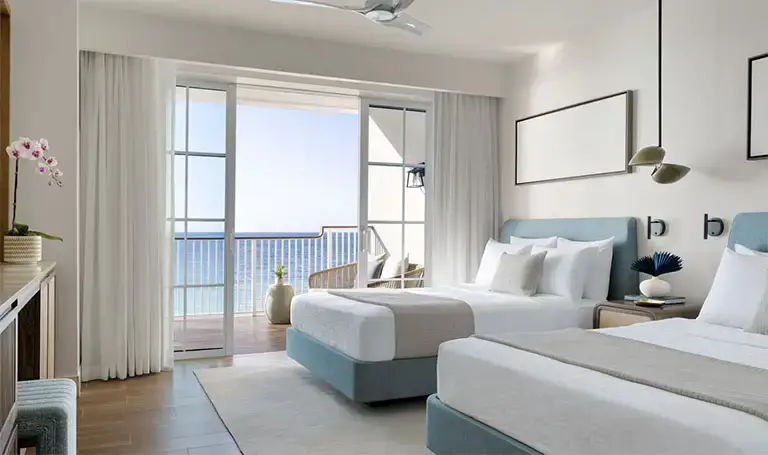 Oceanview bedroom with blue accents at Beaches Negril