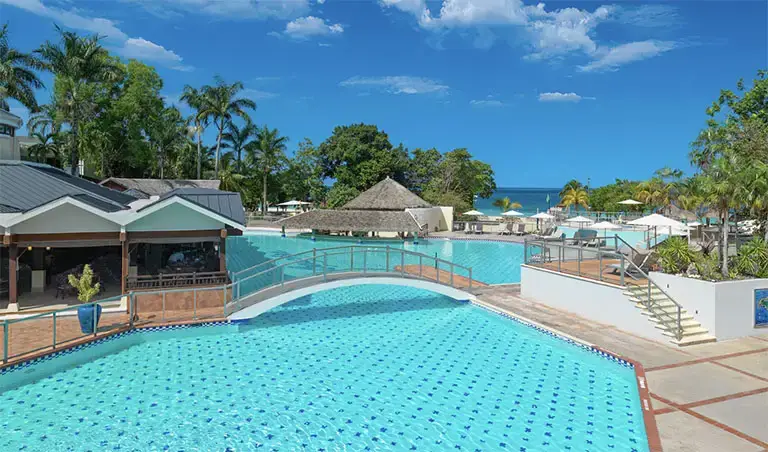Pool deck with swim-up bar at Beaches Negril