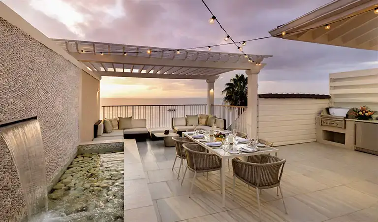 Rooftop terrace dining area at Beaches Negril at sunset