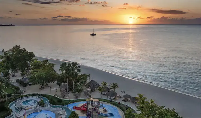 Sunset aerial view of the pool and beach at Beaches Negril