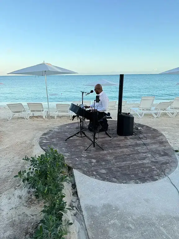 Live musician performing on the beach at Beaches Turks & Caicos