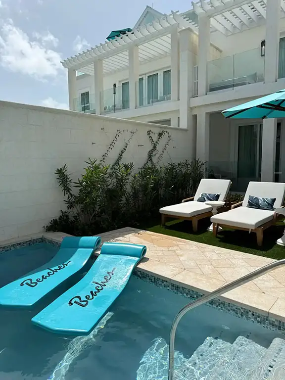 Pool with Beaches-branded inflatable pool floats