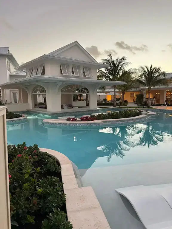 Resort exterior with pool and gardens at dusk, Beaches Turks & Caicos