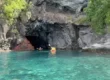 Kayakers exploring a sea cave, part of a Caribbean adventure excursion