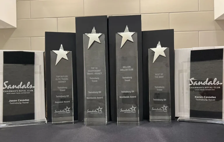 Sandals Chairman's Royal Club Platinum and Elite award trophies for Jason and Karen Cavadas of Twinsburg Travel