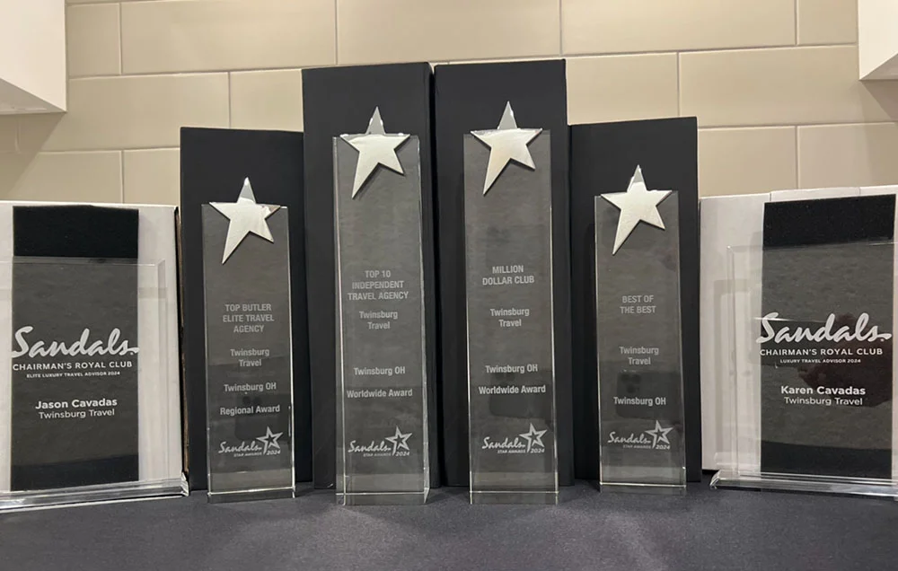 Sandals Chairman's Royal Club Platinum and Elite award trophies for Jason and Karen Cavadas of Twinsburg Travel