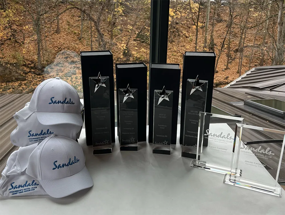 Sandals Chairman's Royal Club award trophies and branded caps for Twinsburg Travel