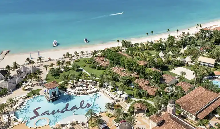 Aerial view of the beach and resort grounds at Sandals Grande Antigua