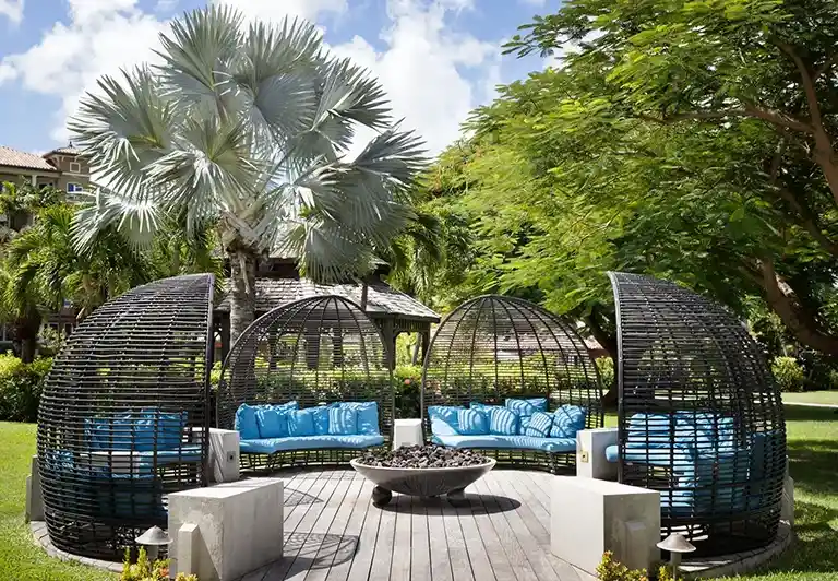 Outdoor firepit lounge seating at Sandals Grande Antigua
