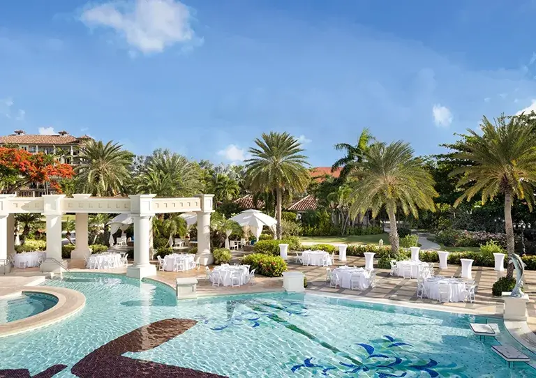 Poolside wedding reception setup at Sandals Grande Antigua