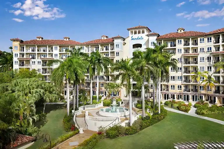 Resort building with courtyard fountain at Sandals Grande Antigua