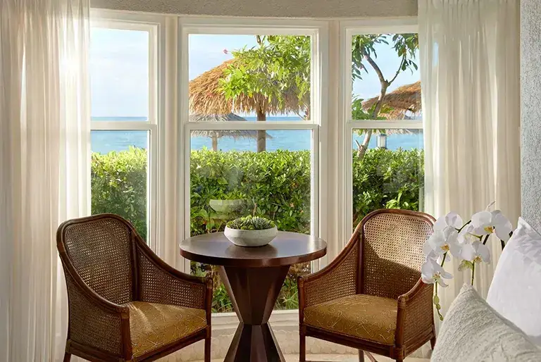 Rondoval suite sitting area with ocean view at Sandals Grande Antigua