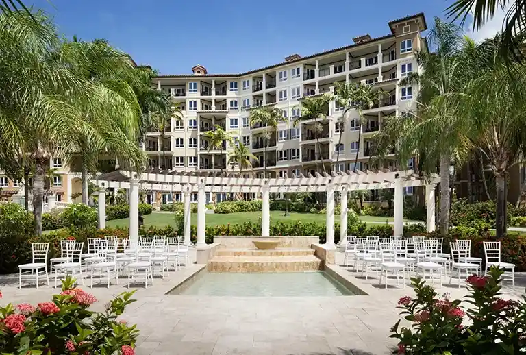 Wedding seating near the courtyard fountain at Sandals Grande Antigua