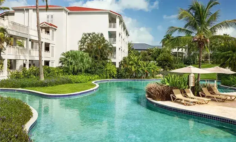 Lagoon-style pool winding through the grounds at Sandals Grande St. Lucian