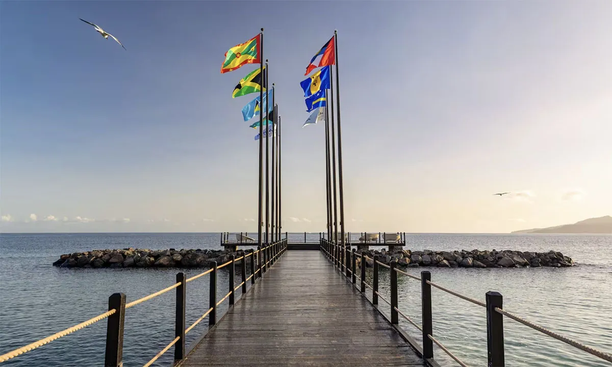 Wooden pier with colorful flags for excursions at Sandals Grenada