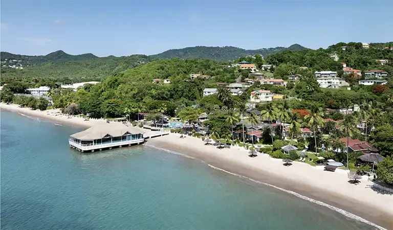 Aerial view of Sandals Halcyon Beach resort with piers