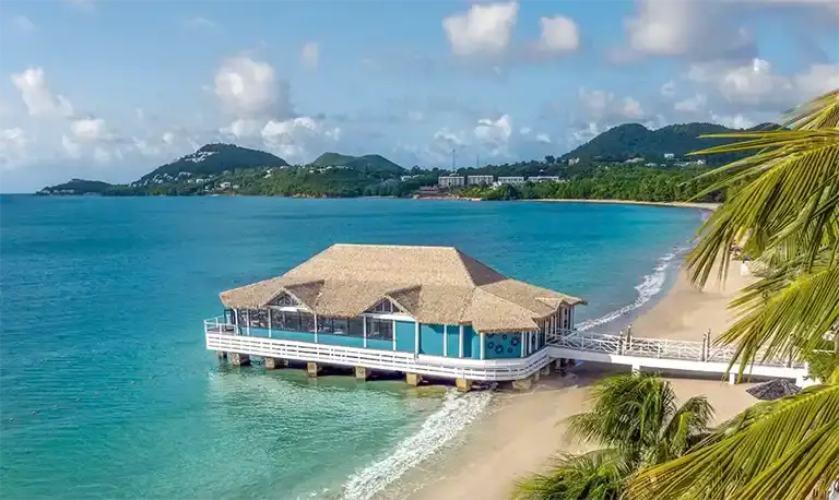 Overwater pier restaurant at Sandals Halcyon Beach