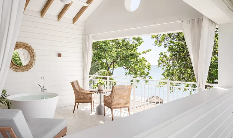 Villa deck with soaking tub and ocean view at Sandals Halcyon Beach