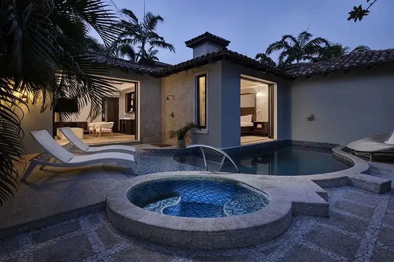One Bedroom Butler Pool Suite at dusk at Sandals La Source Grenada