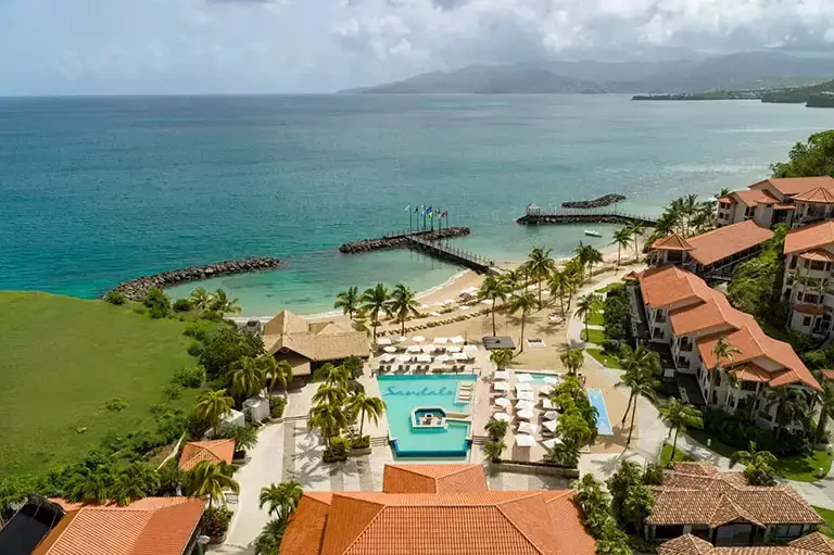 Aerial drone view of the ocean and beach at Sandals La Source Grenada