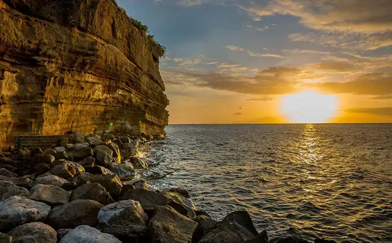 Cliffside grounds overlooking the beach at Sandals La Source Grenada