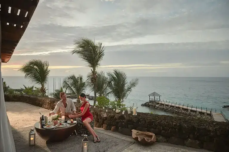 Romantic dinner by the rock wall at Sandals La Source Grenada