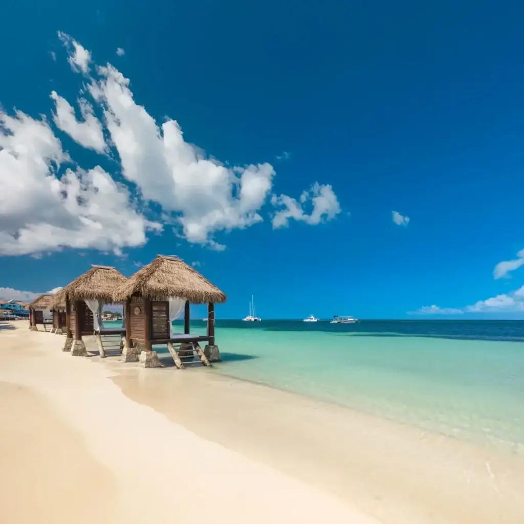 Aerial drone view of the beach and cabanas at Sandals Montego Bay