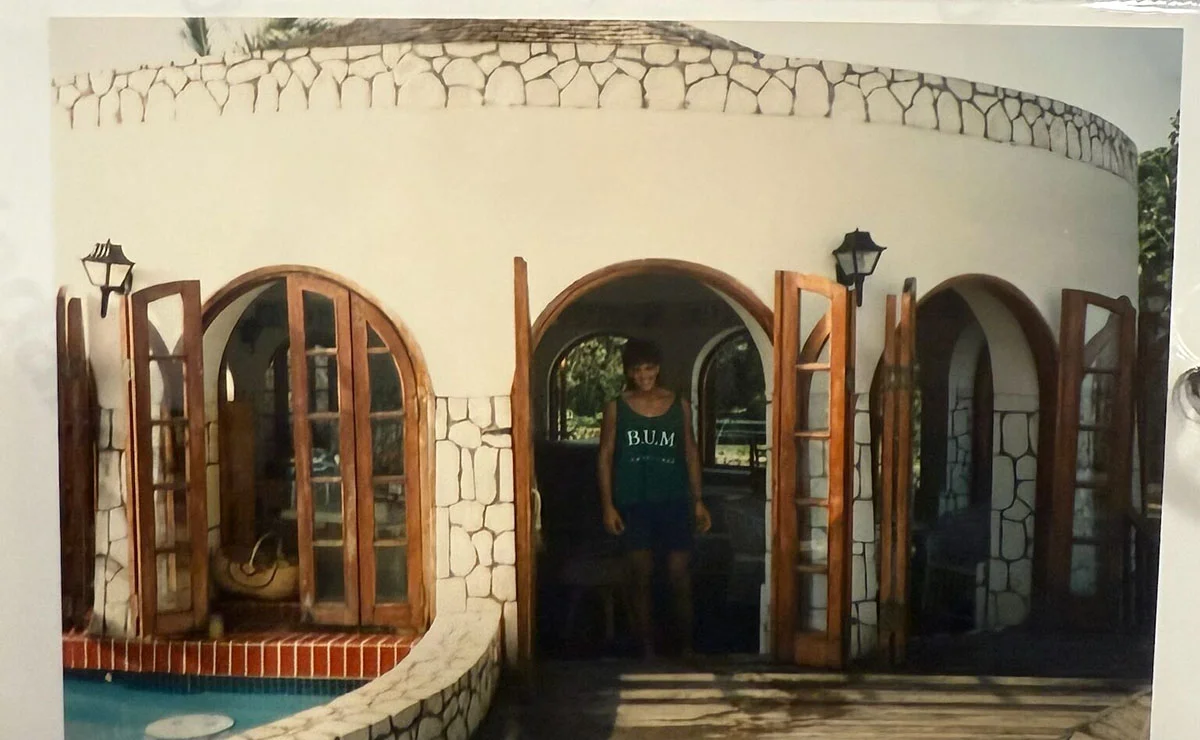 Guest standing in a white stone archway courtyard at Sandals Montego Bay