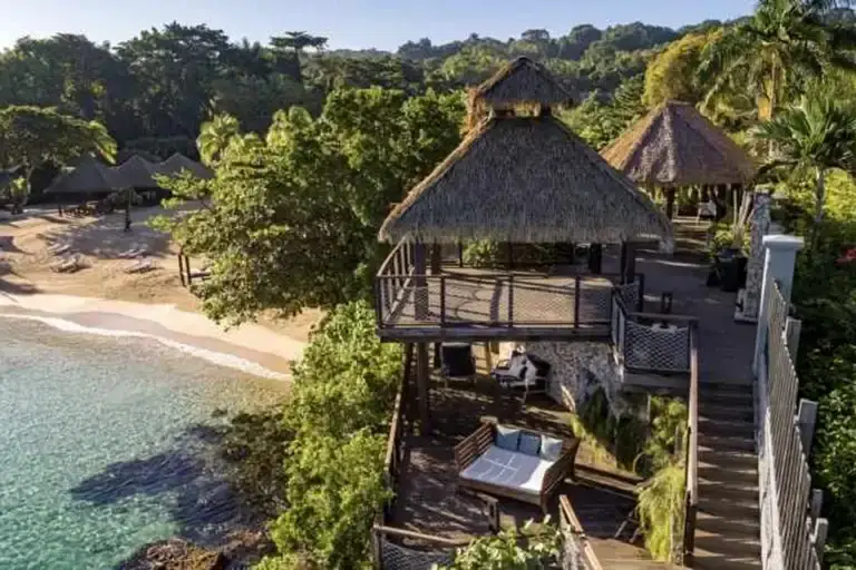 Clifftop treehouse gazebo overlooking the ocean and beach at Sandals Ochi Rios