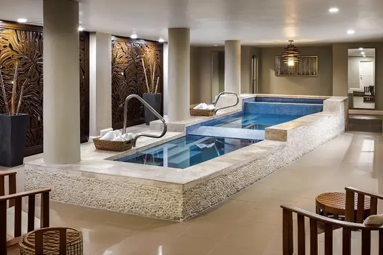 Indoor spa plunge pools with modern decor at Sandals Ochi Rios