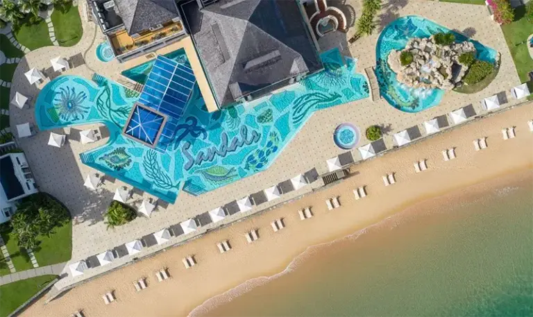 Aerial view of the pool and beach at Sandals Regency La Toc