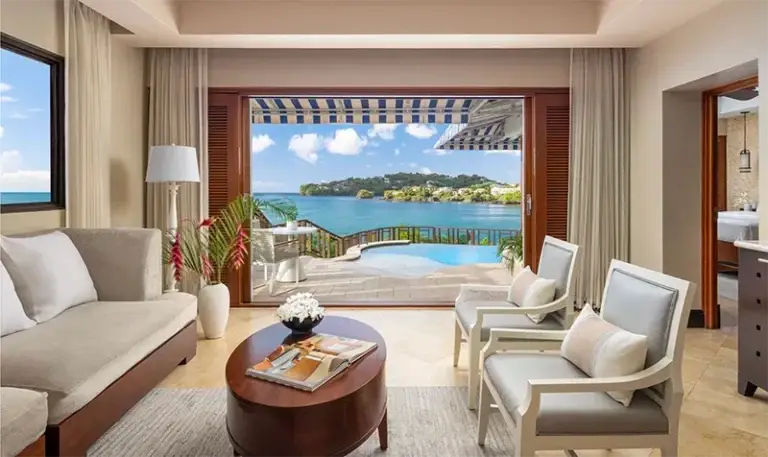 Suite living room with balcony ocean view at Sandals Regency La Toc, St. Lucia