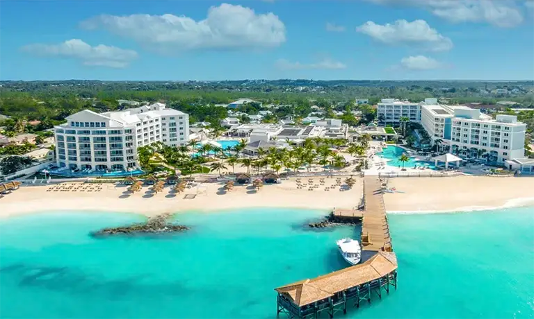 Aerial view of Sandals Royal Bahamian resort, beach, and pier in Nassau