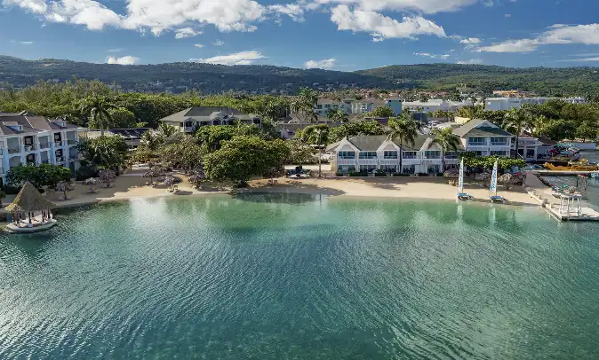 Aerial view of the coastal village and beach at Sandals Royal Caribbean