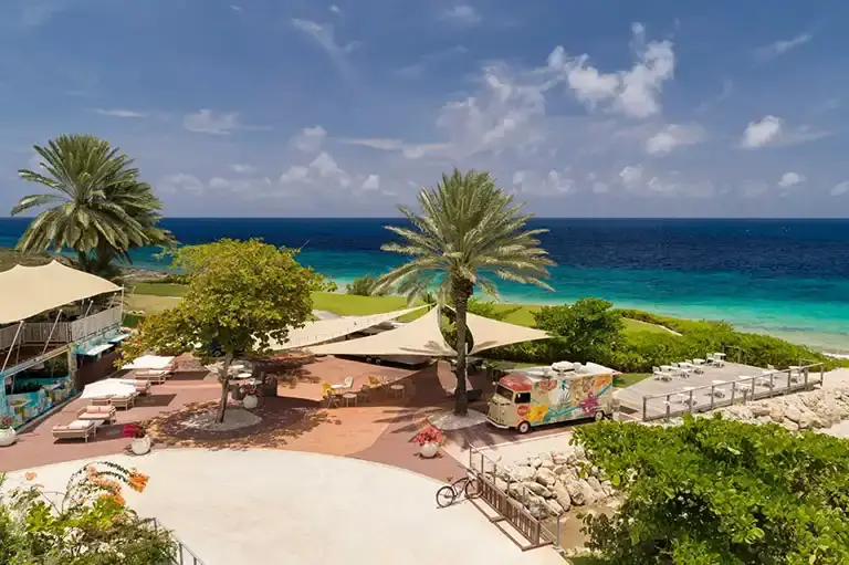 Dining tables at the Food Trucks restaurant at Sandals Royal Curacao