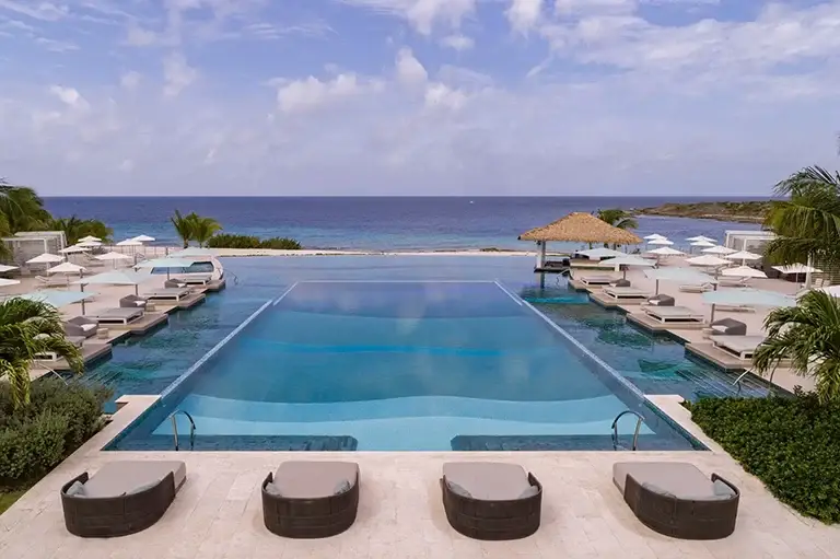 Main pool with panoramic ocean views at Sandals Royal Curacao