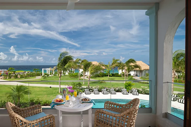 Suite balcony with seating at Sandals Royal Curacao