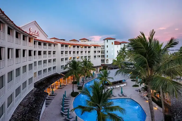 Aerial night view of the resort pool at Sandals Barbados