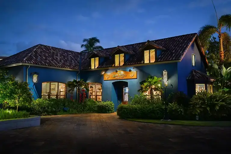 Merry Monkey restaurant exterior in the evening at Sandals Barbados