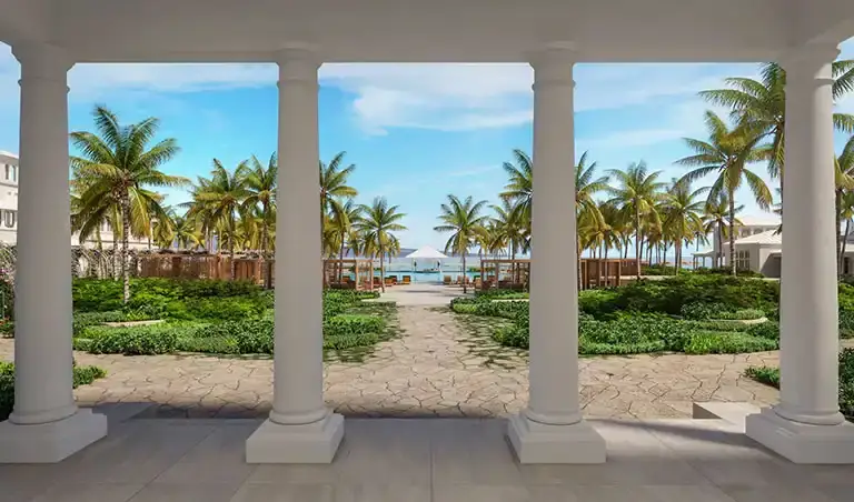 Columned walkway view of the beach at Sandals South Coast