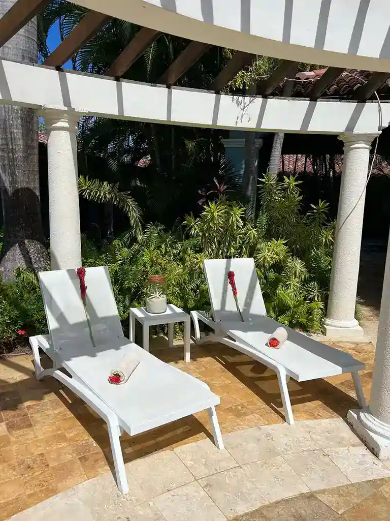 Lounge chairs on a gazebo patio at Sandals South Coast