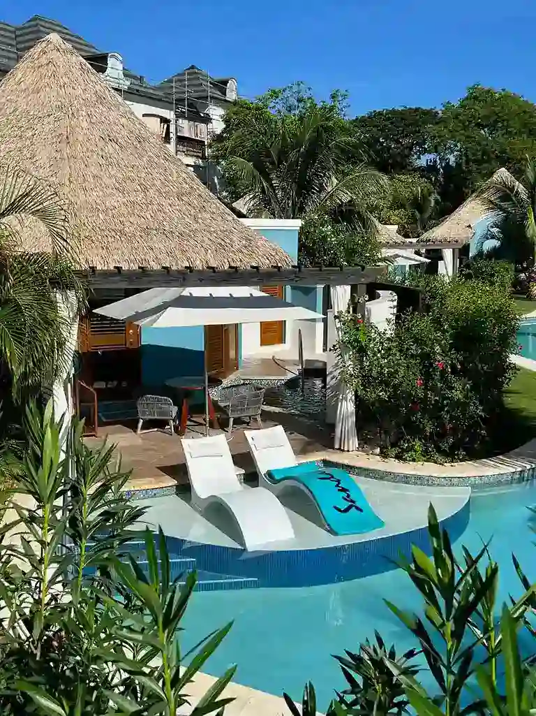 Thatched-roof swim-up bar at the pool at Sandals South Coast