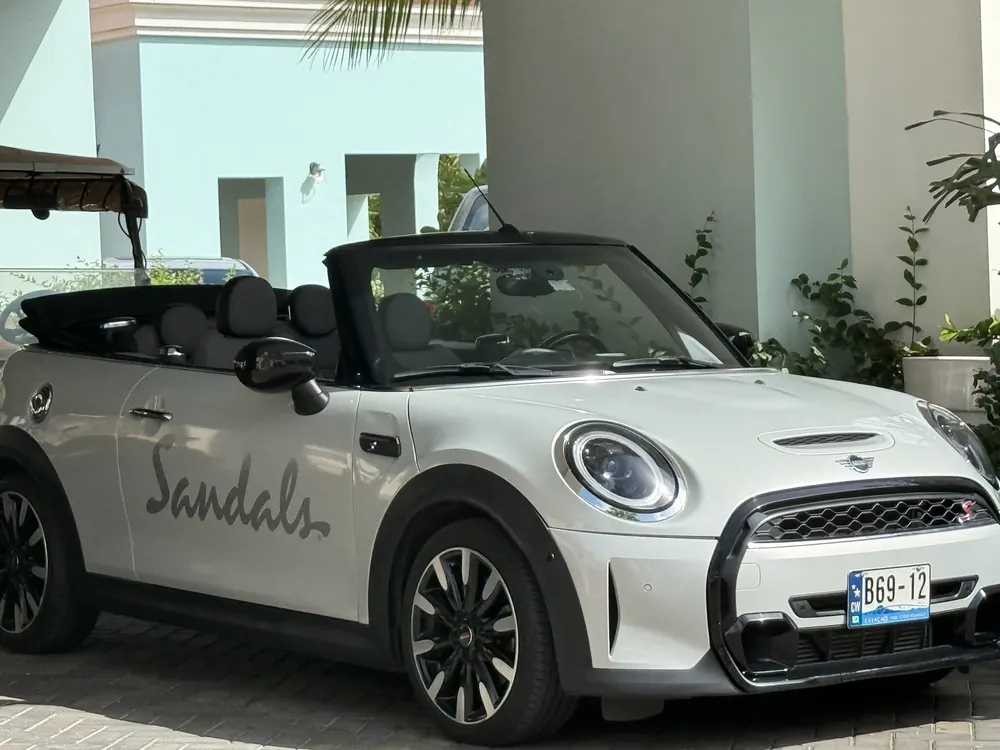 Sandals-branded white MINI Cooper convertible at Sandals Royal Curaçao